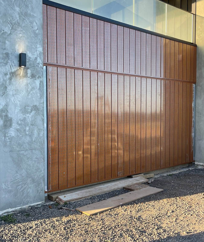 Garage door cladding